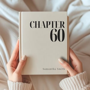 May include: A cream-colored hardcover book with black text on the front cover that reads CHAPTER 60 in large bold letters and Samantha Smith in smaller font at the bottom. The book is held upright, showcasing a clean, minimalist design.