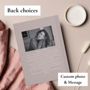 May include: A personalized photo book with a custom message. The book features a black and white photo of a smiling person. Text on the book reads "Happy 30th Birthday!" and "Custom photo & Message."