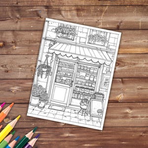 May include: Black and white line art illustration of a storefront with a striped awning. The storefront has a window display with shelves of products and a door. There are plants hanging from the ceiling and potted plants outside the store.