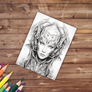 May include: A black and white detailed pencil drawing of a woman's face with intricate, organic, and geometric patterns surrounding her head.