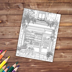 May include: A black and white line drawing of a storefront with a window display of various goods. The storefront is decorated with flowers and vines. There is a small table and chairs outside the store.