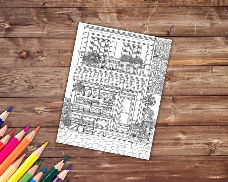 May include: A black and white line drawing of a storefront with a balcony, awning, and shelves filled with produce. The storefront is a two-story building with a door and windows. There are plants and flowers in pots outside the building.