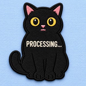 May include: An embroidered patch of a black cat with large yellow eyes, pink inner ears, and a pink nose. The cat is sitting in a forward-facing position with the white text "PROCESSING..." stitched across its chest on a light blue background.