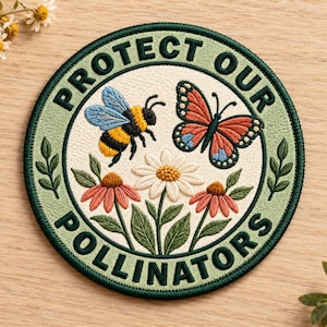 May include: A circular embroidered patch featuring a cream-colored center with a bumblebee, a monarch butterfly, and three flowers. The border is sage green with the dark green text "PROTECT OUR POLLINATORS" and small leaf accents.