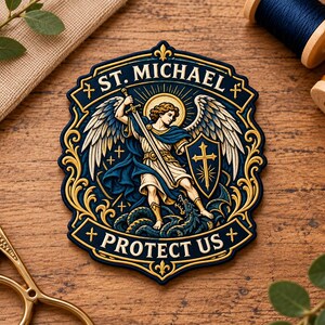 May include: A shield-shaped embroidered patch featuring an illustration of St. Michael with wings, a sword, and a shield, standing over a dragon. The text ST. MICHAEL and PROTECT US is displayed in gold lettering on a dark blue background.