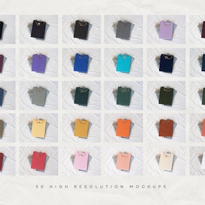 May include: A grid of 30 folded t-shirts in various colors, including black, purple, blue, green, and orange. Each shirt is displayed on a white surface. The text "30 HIGH RESOLUTION MOCKUPS" is at the bottom.