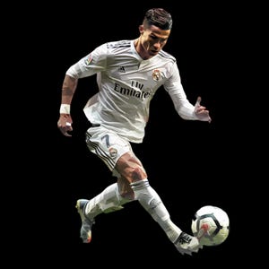 May include: A soccer player in a white jersey with black trim and the words "Fly Emirates" on the front, kicking a white and black soccer ball. The player is wearing white socks and black cleats.