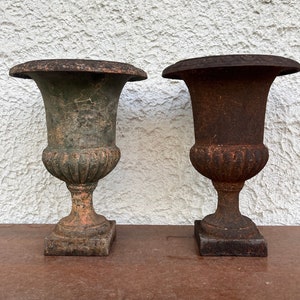 Pair of cast iron garden vases, Mid Century, 1930s. Italian production