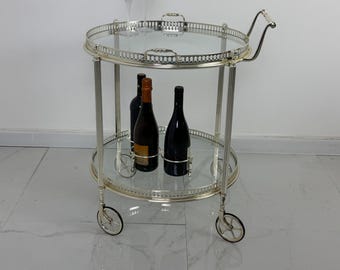 Carrinho de bar circular em latão cromado, estilo meados do século XX, década de 1960.