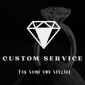 May include: A diamond ring with a large, clear diamond stone. The ring is on a black background with the text "CUSTOM SERVICE FOR SOME ONE SPECIAL".