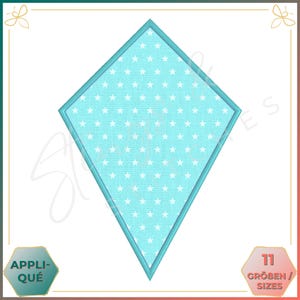 May include: A turquoise diamond-shaped appliqué with a white star pattern. The appliqué is outlined in turquoise.