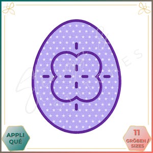 May include: A purple egg-shaped design with a white star pattern and a four-leaf clover-like shape in the center. The design includes the text "APPLIQUÉ" and "11 GRÖBEN / SIZES".