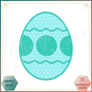 May include: A turquoise blue Easter egg embroidery design with a white background. The egg is decorated with white stars, a wavy line, and three turquoise blue circles.