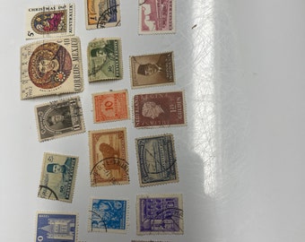 May include: A collection of vintage postage stamps from around the world. The stamps feature a variety of designs, including animals, people, and landmarks. Some of the stamps are brightly coloured, while others are more muted. The stamps are in good condition and would be a great addition to any stamp collection.