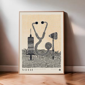 May include: A framed print depicting medical instruments. The artwork shows a stethoscope, a syringe, and a reflex hammer, all in a black and white dotted style against a beige backdrop. The text "YOTIF MEDICAL COLLECTION | INSTRUMENTS" is at the bottom.