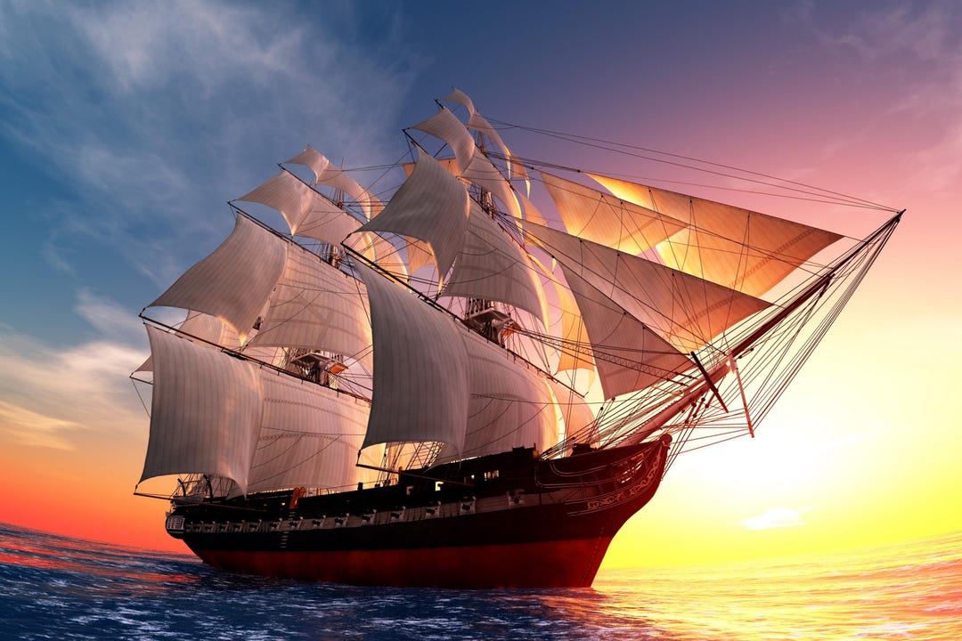 夕焼けの帆船キャンバス – オレンジ＆ブルーの航海用ウォールアート