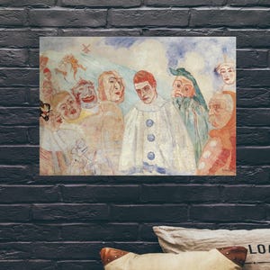 May include: A framed print of a painting depicting a group of figures in theatrical costumes. The artwork features a central figure in a white costume with blue accents, surrounded by other characters with expressive faces and masks. The color palette includes muted tones of beige, red, and blue.