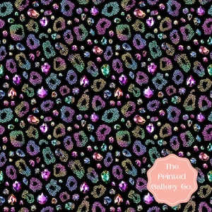 May include: A black background is covered with a pattern of colorful, jewel-like shapes and gemstones. The shapes are in shades of gold, green, purple, and blue. The gemstones are in various shapes and sizes, with a pink logo in the bottom right corner.
