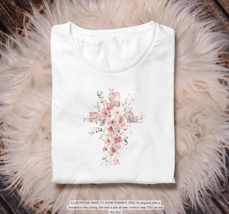 以下が含まれることがあります： 水彩画の十字架のデザインが特徴の白いTシャツ。十字架はピンクとピーチ色の花と緑の葉で飾られています。下部のテキストは次のとおりです：可能な用途を示すためのイラスト画像。このリストには物理的なアイテムは含まれていませんが、このファイルをYOUが使用できるいくつかの創造的な方法をご覧ください！
