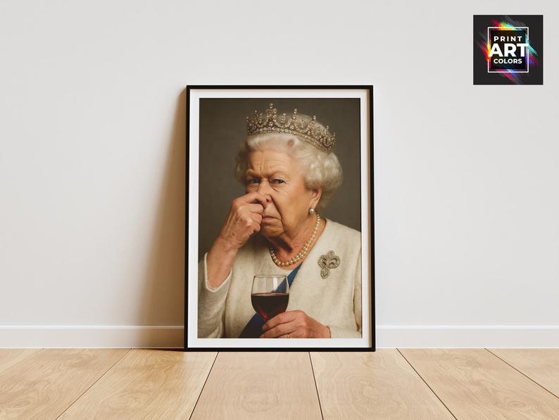 May include: Framed print featuring a portrait of Queen Elizabeth II, wearing a crown and pearl necklace, holding a glass of red wine. The image has a humorous theme, with the Queen pinching her nose.