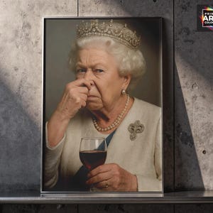 May include: A framed print featuring a portrait of Queen Elizabeth II, wearing a crown, pearl necklace, and a brooch. She is holding a glass of red wine and pinching her nose. The print has the text "PRINT ART COLORS" in the upper right corner.