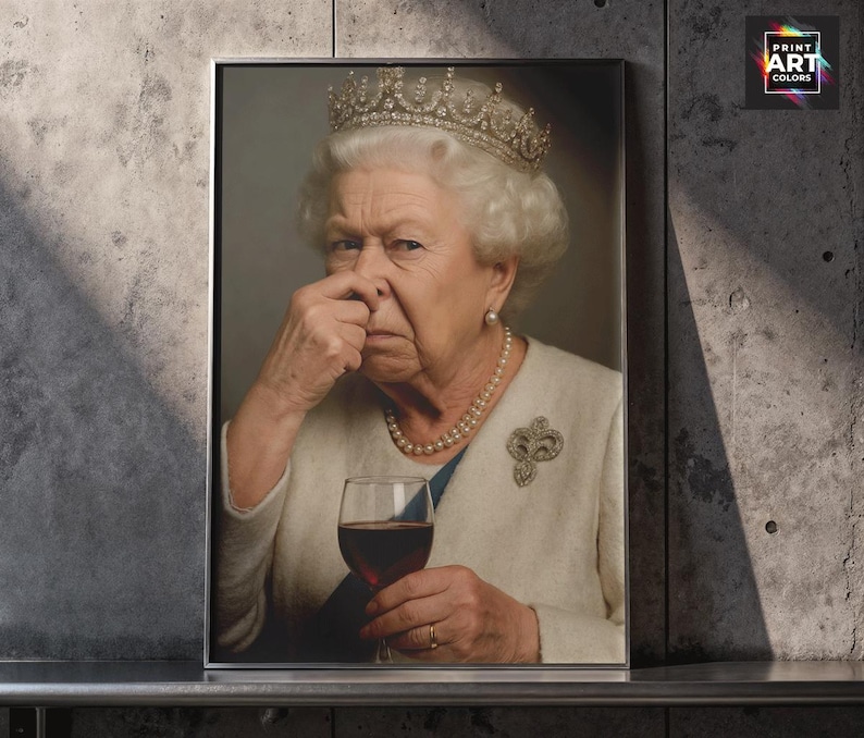 May include: A framed print featuring a portrait of Queen Elizabeth II, wearing a crown, pearl necklace, and a brooch. She is holding a glass of red wine and pinching her nose. The print has the text "PRINT ART COLORS" in the upper right corner.