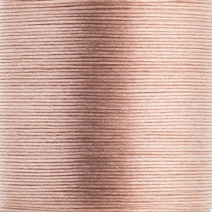 May include: Close-up of a spool of light brown thread. The thread is tightly wound, with visible horizontal lines. The colour is a muted, neutral tone, suitable for various crafting projects.