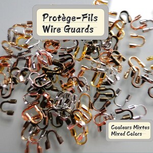 May include: A collection of mixed-color wire guards, including silver, gold, copper, and bronze tones. The image includes text that reads "Protège-Fils Wire Guards" and "Mixed Colors."