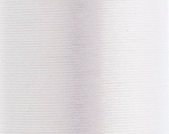 May include: A spool of white sewing thread featuring a tightly wound cylindrical structure. The surface displays a consistent, fine horizontal texture created by the individual strands of thread wrapped around the central core of the spool.