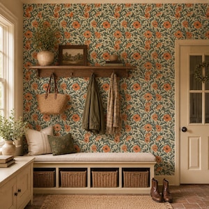 May include: A hallway entryway featuring floral wallpaper with orange poppies and green foliage. A wooden bench with four woven baskets sits below a shelf holding a framed picture, a coat, a scarf, and a straw tote bag. A beige cushion rests on the bench.