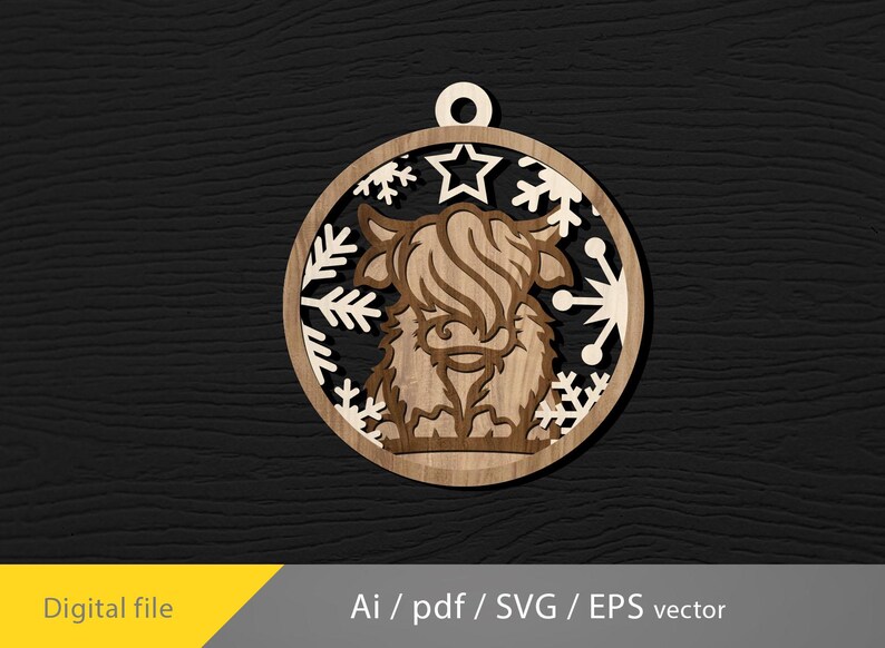 May include: Wooden ornament featuring a Highland cow design. The ornament is circular with a cutout design of a cow, snowflakes, and a star. The ornament is made of light and dark brown wood. The text "Digital file" is in the lower left corner.