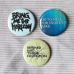 Bring Me The Horizon set of three 25mm (1 inch) button pin badges with exclusive designs.