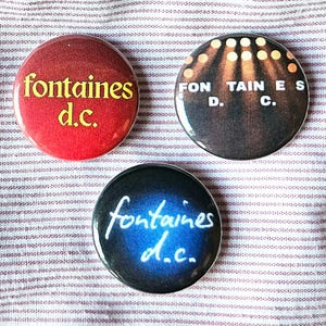 Fontaines D.C. set of three 25mm (1 inch) button badges with exclusive fan art designs.