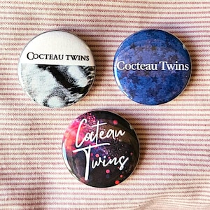 The Cocteau Twins set of three 25mm (1 inch) button pin badges, including 'Blue Bell Knoll' and exclusive designs.