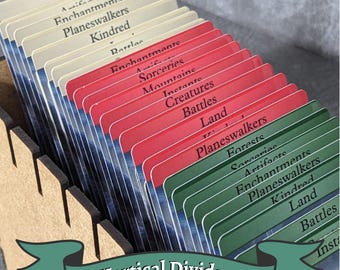 May include: A set of vertical dividers for organizing cards, with labels in white, red, and green. The dividers are arranged in a wooden holder, with the words "Vertical Dividers" on a banner at the bottom.