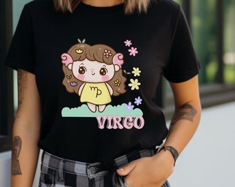 May include: Black t-shirt with a cartoon illustration of a Virgo zodiac sign. The illustration features a girl with brown hair, wearing a yellow dress and holding a pink 'Virgo' symbol. The design is surrounded by pink, yellow, and purple flowers.