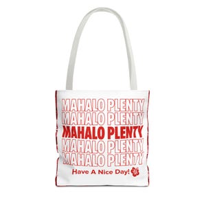 May include: A white tote bag with two shoulder straps featuring the repeated red text MAHALO PLENTY in a stacked block layout. Below the text, the phrase Have A Nice Day! is printed in red, accompanied by a small red hibiscus flower graphic.