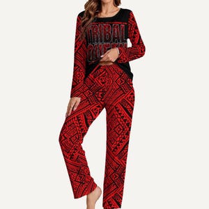 May include: A two-piece pajama set featuring a black top with the text "TRIBAL QUEEN" in silver lettering and red long sleeves. The matching red pants have a black tribal pattern.