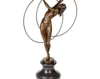 Grace in Motion: A Mesmerizing Bronze Sculpture of a Hoop Dancer, Inviting You to Dance with Elegance