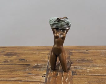 Seductive Bronze Sculpture of a Disrobing Woman