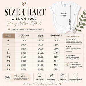 May include: A Gildan 5000 heavy cotton t-shirt size chart displaying measurements in inches for sizes S through 5XL. The chart includes columns for chest width, length, and sleeve length, along with a diagram showing how to measure the garment.