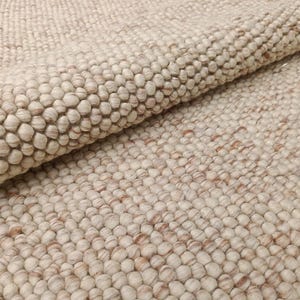 Tappeto in lana grossa intrecciato a mano: tappeto scandinavo minimalista color avorio