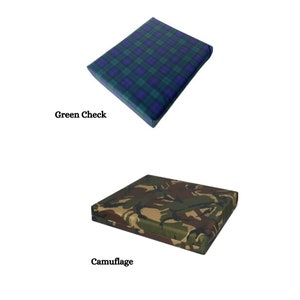 May include: Two square seat cushions, one with a green and blue plaid pattern labeled "Green Check" and the other with a camouflage pattern labeled "Camouflage".