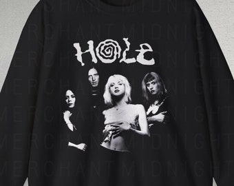 May include: Black sweatshirt with a white graphic of the band Hole. The graphic features a photo of the band members and the band's name in a stylized font.