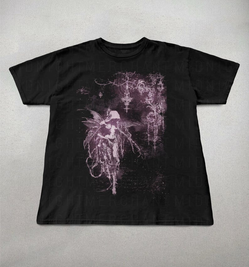 May include: Black t-shirt featuring a detailed, gothic-style illustration in shades of purple and white. The design includes a figure with wings, intricate floral and architectural elements, and a dark, atmospheric background.