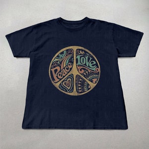 May include: A navy blue t-shirt with a peace sign graphic. The peace sign is filled with colorful designs and the words "Peace" and "Love" are written inside the symbol.