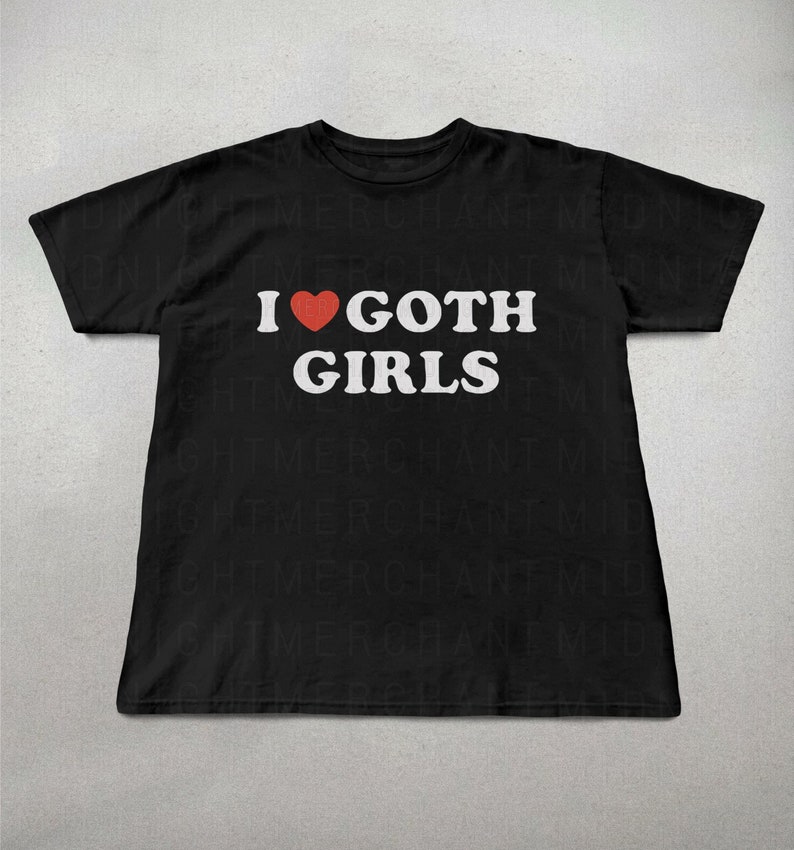 May include: Black t-shirt with white text that reads "I &hearts; GOTH GIRLS". The heart is red.