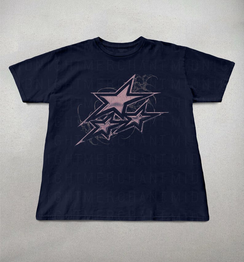 May include: A navy blue t-shirt with a pink graphic of three stars in a stylized design. The stars are outlined in black and have a faded, distressed look.
