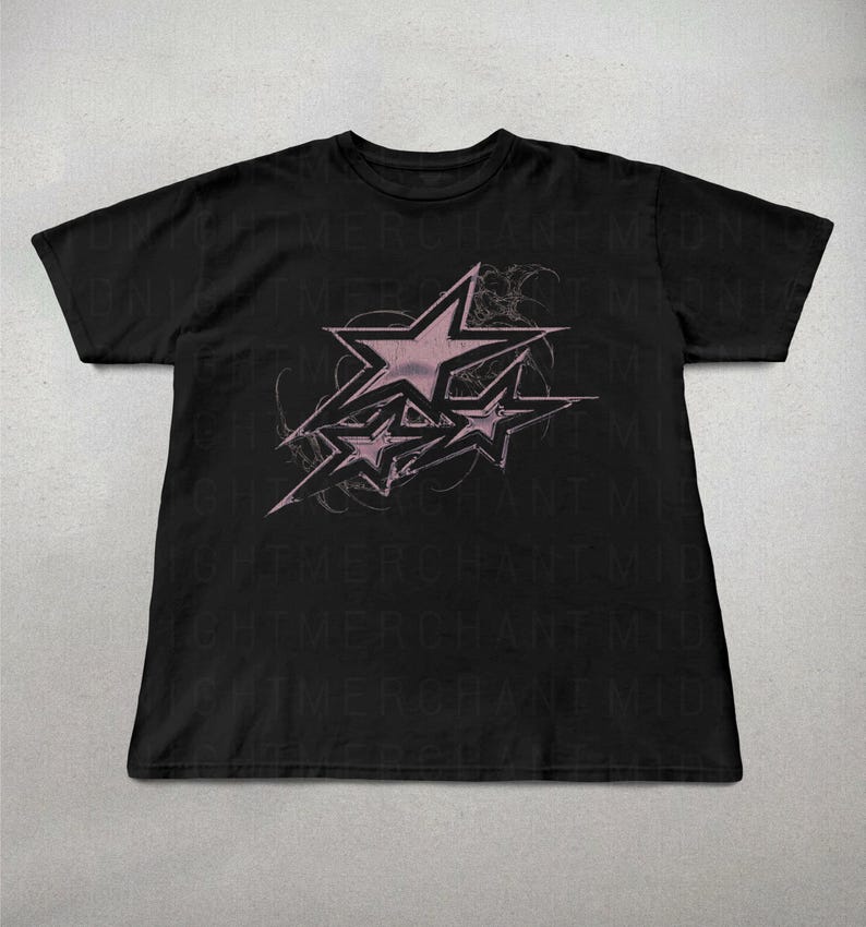 May include: Black t-shirt with a pink graphic of three stars on a black background. The stars are stylized and have a faded look.
