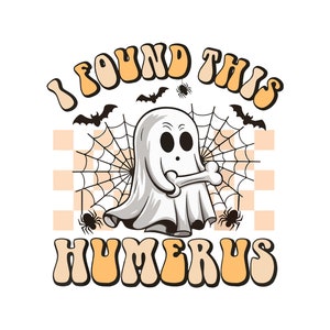 May include: A Halloween-themed graphic featuring a cartoon ghost holding a bone, surrounded by bats, spiders, and a spiderweb. The text "I FOUND THIS HUMERUS" is in a retro font, with a checkered orange and white background.